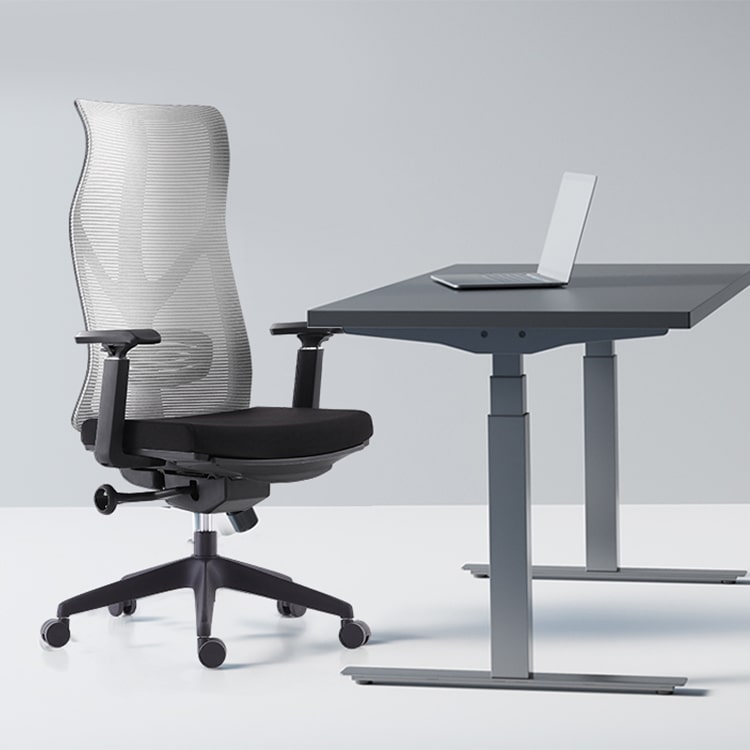 Mesh office chair next to office table